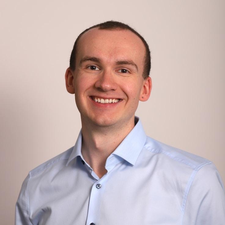 Kaveri Mehta, Lead Design Curator at Sunset Frame Core, reviewing corporate floral arrangements